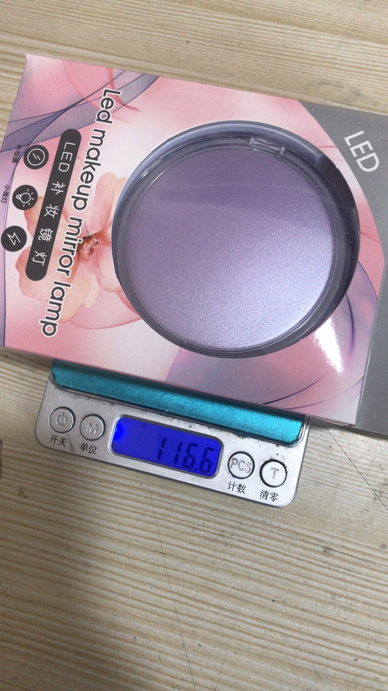 Velorian Collection portable mini LED makeup mirror with illuminated surface for precise beauty application.
