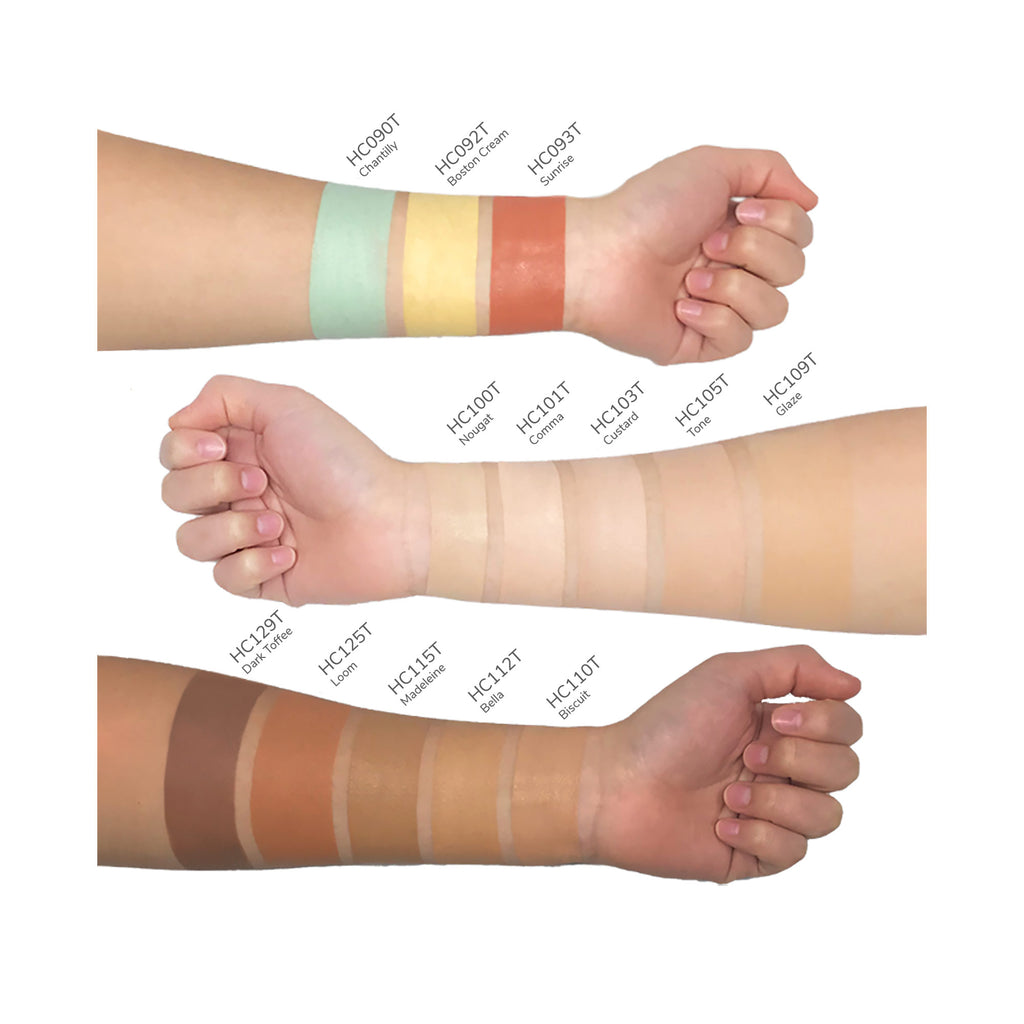 Swatches of Cad b Comma HC101T concealing cream demonstrating full coverage and brightening shades on a neutral background.