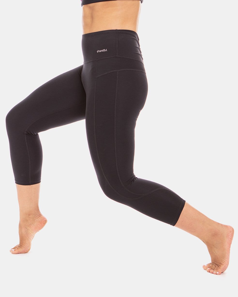 Handful Squeeze Play High-Waist Capri leggings in Booya Black, shown from the side, featuring a fitted high-waist design.